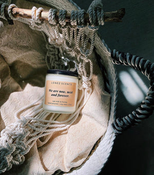 conversation statement candles scented with a blend of oat milk and honey. candle pictures in a woven basket with textured fabric.